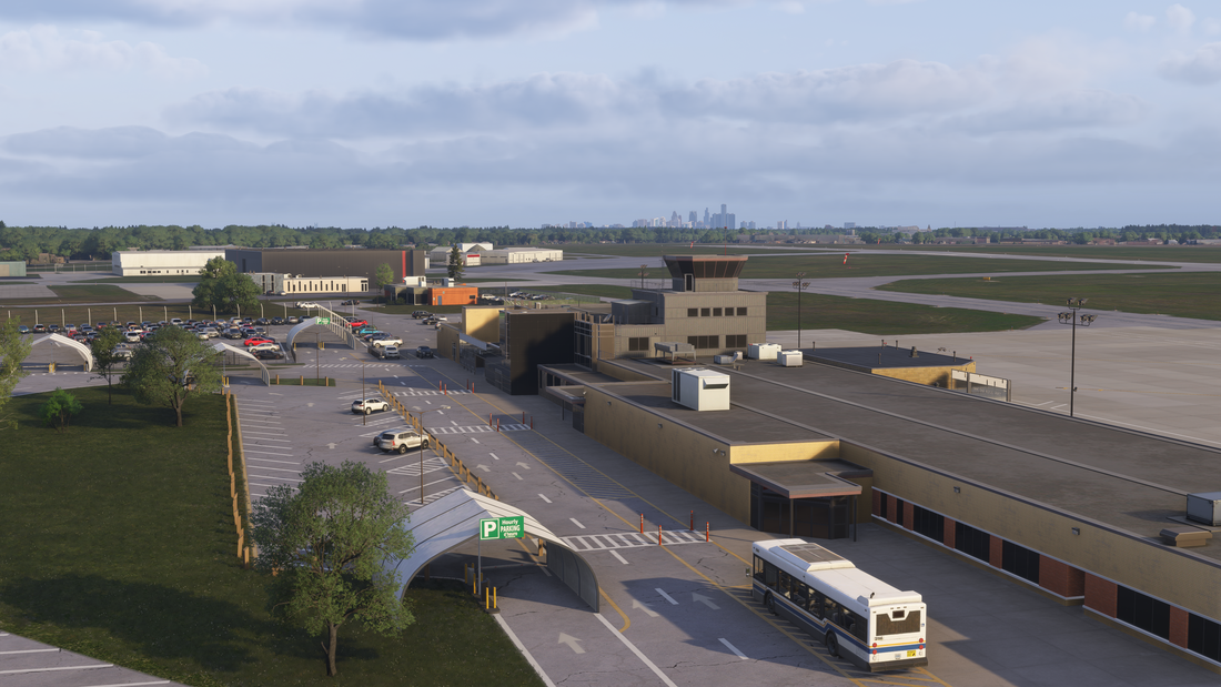 Windsor International Airport terminal and control tower with parking lanes, cars, and a bus in the simulator