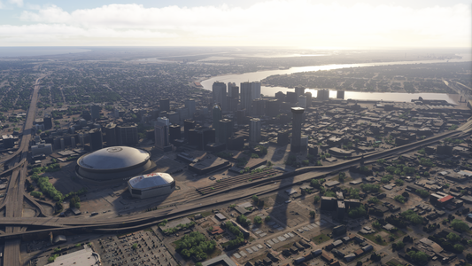 Daytime aerial view of New Orleans showing the domed stadium, downtown towers and Mississippi River