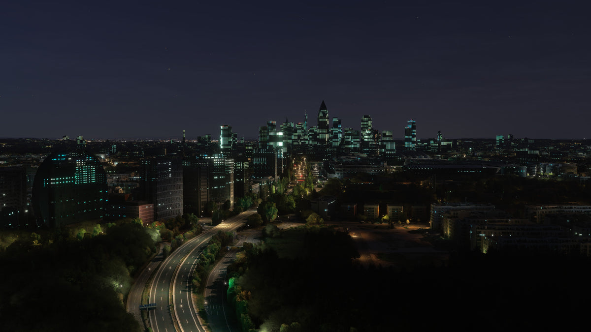 Default MSFS scenery: Frankfurt skyline and rounded foreground building at night