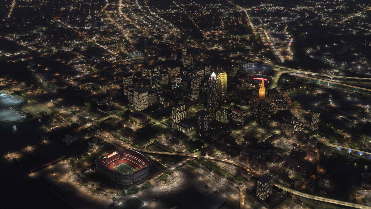 High aerial view of Cleveland at night, with the football stadium, illuminated downtown blocks, and surrounding streets in Ohio MSFS scenery.