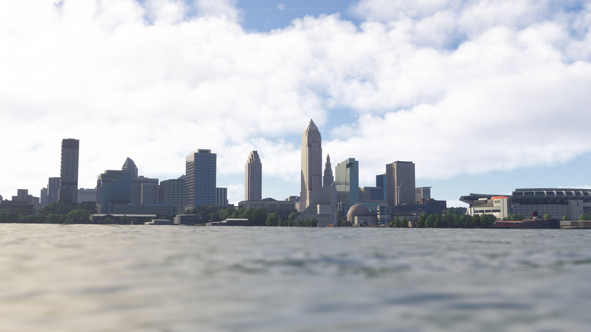 Daylight view across the water toward the Cleveland skyline, waterfront buildings, and stadium in Ohio MSFS scenery.