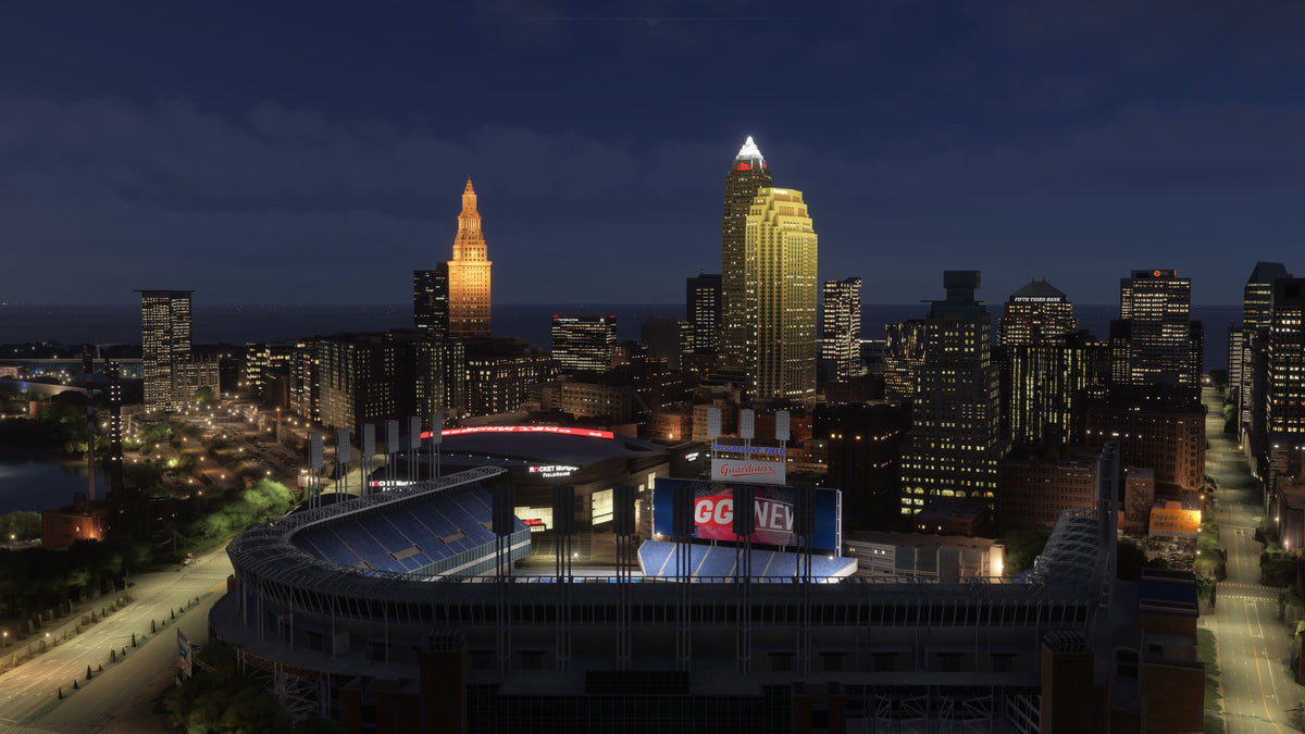 Progressive Field and the arena beneath illuminated downtown towers at night in Cleveland, Ohio MSFS scenery.