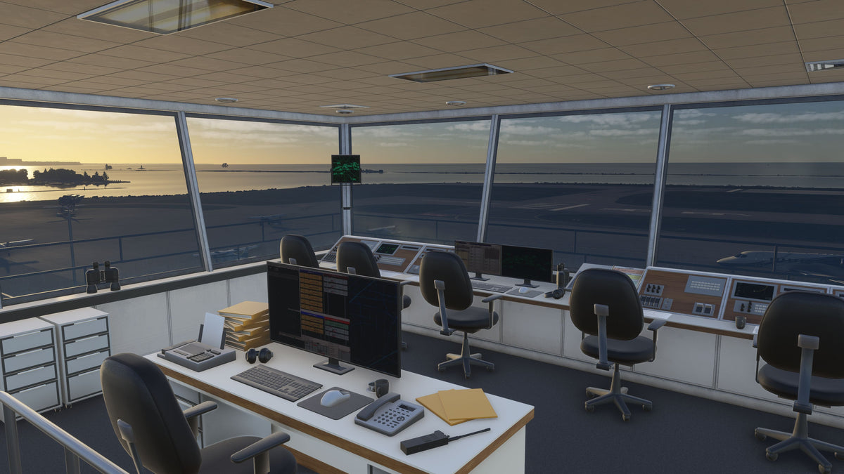 KBKL control tower interior with consoles, monitors, chairs and desks overlooking the airfield and Lake Erie in MSFS.