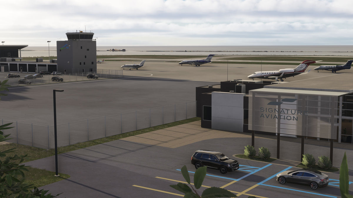 Elevated view of the Signature Aviation building, parked business jets, KBKL control tower and Lake Erie in daylight in MSFS.