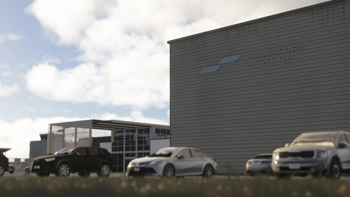 Close view of Signature Aviation signage on the KBKL hangar exterior, with parked cars and the reception building in MSFS.