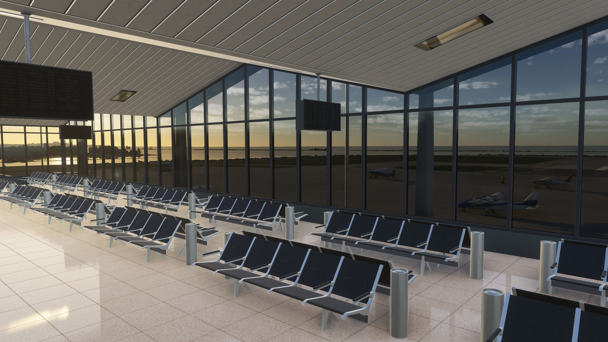 KBKL terminal lounge interior with rows of seats, overhead display screens and tall windows overlooking the apron in MSFS.